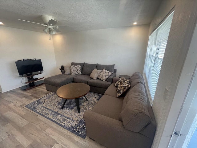 2011 58th Ave N Unit 20, Saint Petersburg, FL 33714 - living area with a textured ceiling, ceiling fan, and wood finished floors
