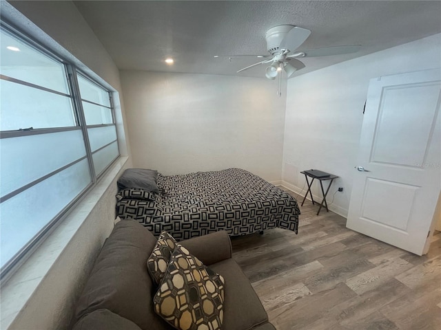 2011 58th Ave N Unit 20, Saint Petersburg, FL 33714 - bedroom featuring wood finished floors, baseboards, recessed lighting, and a ceiling fan