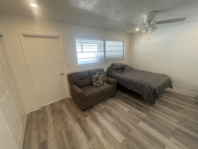 2011 58th Ave N Unit 20, Saint Petersburg, FL 33714 - bedroom featuring wood finished floors, ceiling fan, and a textured ceiling