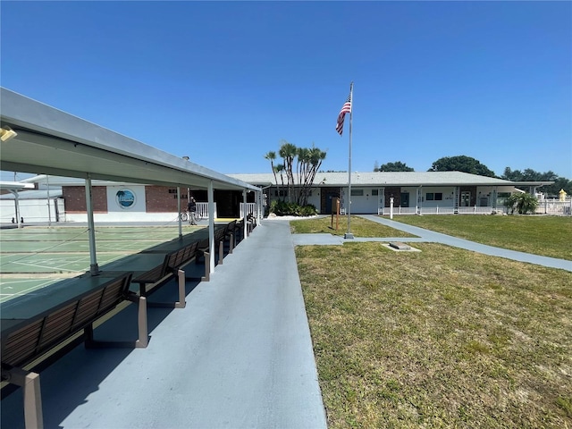 2011 58th Ave N Unit 20, Saint Petersburg, FL 33714 - view of home's community featuring shuffleboard and a lawn
