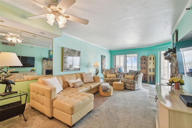 17980 Gulf Blvd Unit 505, Redington Shores, FL 33708 - carpeted living area with ceiling fan, ornamental molding, and a textured ceiling
