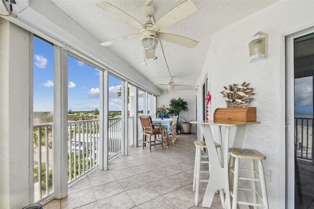 17980 Gulf Blvd Unit 505, Redington Shores, FL 33708 - sunroom / solarium featuring a textured ceiling, a textured wall, and tile patterned flooring