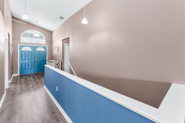 6521 Oelsner St, New Port Richey, FL 34652 - entrance foyer with wood finished floors, baseboards, and high vaulted ceiling