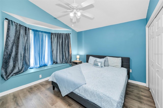 6521 Oelsner St, New Port Richey, FL 34652 - bedroom featuring vaulted ceiling, wood finished floors, a closet, baseboards, and ceiling fan
