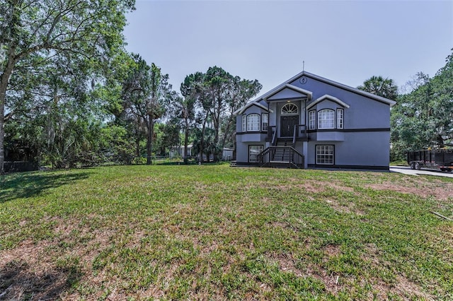 6521 Oelsner St, New Port Richey, FL 34652 - view of front of property with a front lawn
