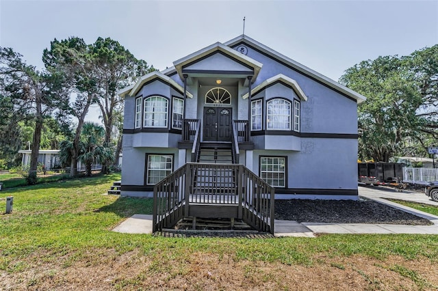 6521 Oelsner St, New Port Richey, FL 34652 - view of front of home featuring a front yard and stucco siding