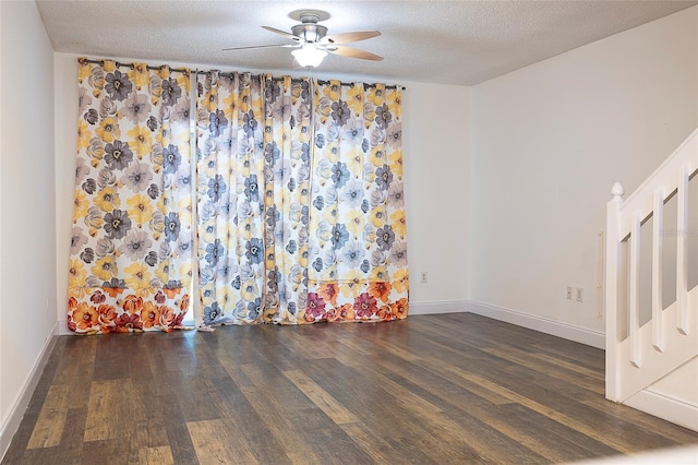 8545 Hunters Key Cir, Tampa, FL 33647 - empty room with wood finished floors, ceiling fan, a textured ceiling, and baseboards