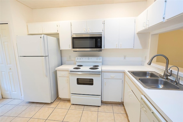 8545 Hunters Key Cir, Tampa, FL 33647 - kitchen with white appliances, a sink, light countertops, and white cabinetry