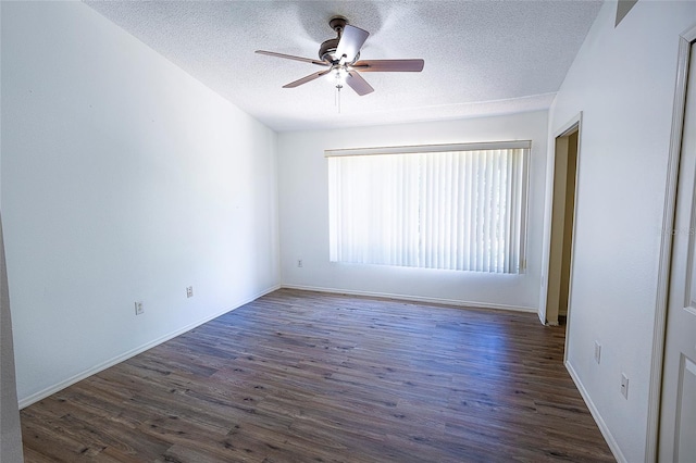 8545 Hunters Key Cir, Tampa, FL 33647 - empty room with ceiling fan, dark wood-style floors, a textured ceiling, and baseboards