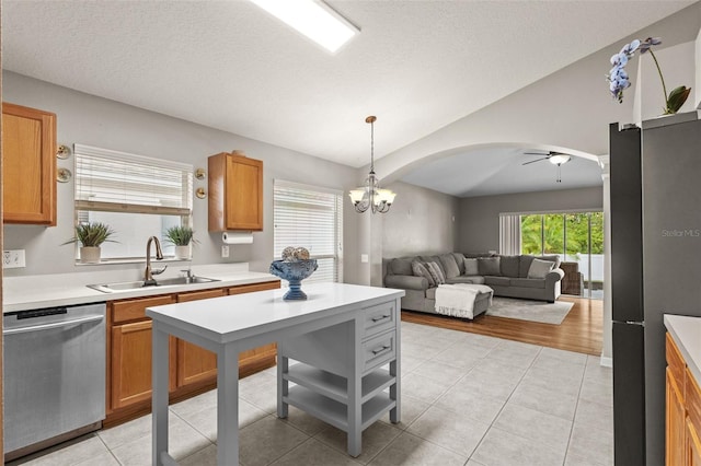 25332 Lexington Oaks Blvd, Wesley Chapel, FL 33544 - kitchen featuring dishwasher, a sink, a ceiling fan, light countertops, and open floor plan