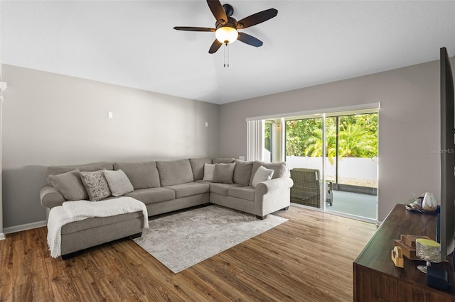 25332 Lexington Oaks Blvd, Wesley Chapel, FL 33544 - living room with wood finished floors, ceiling fan, and vaulted ceiling