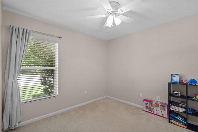 25332 Lexington Oaks Blvd, Wesley Chapel, FL 33544 - rec room with plenty of natural light, carpet, ceiling fan, and baseboards