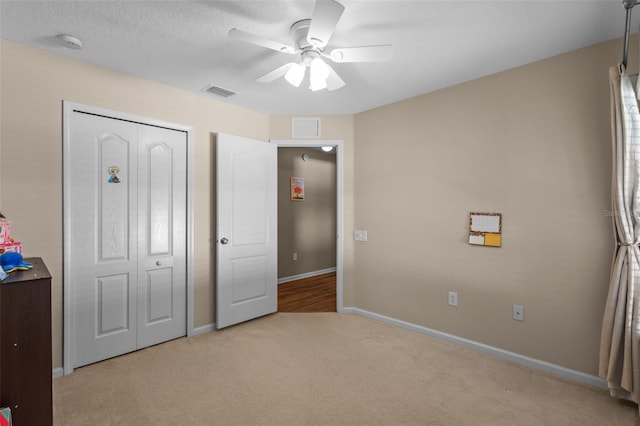 25332 Lexington Oaks Blvd, Wesley Chapel, FL 33544 - unfurnished bedroom with carpet floors, baseboards, ceiling fan, and a closet