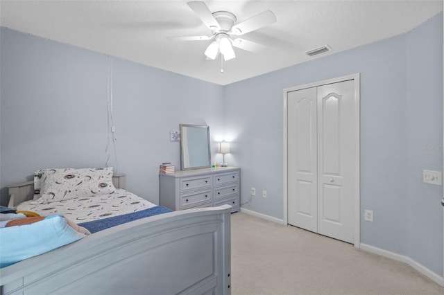25332 Lexington Oaks Blvd, Wesley Chapel, FL 33544 - bedroom featuring light colored carpet, baseboards, a closet, and a ceiling fan