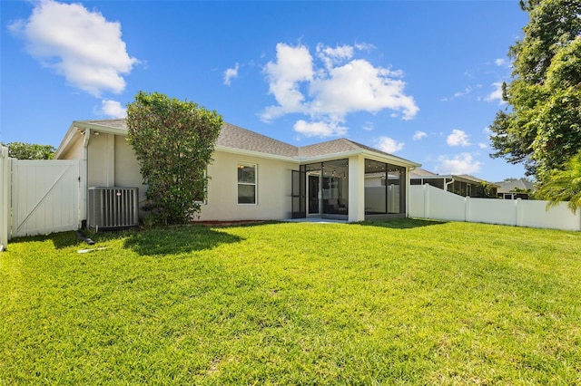 25332 Lexington Oaks Blvd, Wesley Chapel, FL 33544 - back of house featuring a sunroom, central AC unit, a gate, and stucco siding