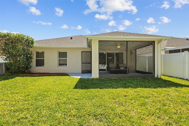 25332 Lexington Oaks Blvd, Wesley Chapel, FL 33544 - back of property featuring a sunroom, stucco siding, a patio, and a shingled roof