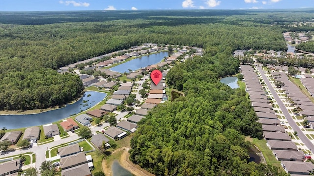 25332 Lexington Oaks Blvd, Wesley Chapel, FL 33544 - view of property location with a heavily wooded area, nearby suburban area, and a nearby body of water