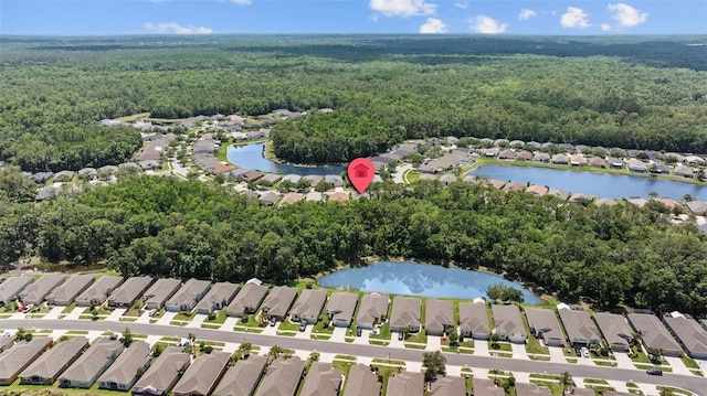 25332 Lexington Oaks Blvd, Wesley Chapel, FL 33544 - aerial view of property's location with nearby suburban area and a heavily wooded area