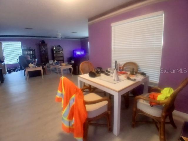 dining space with crown molding