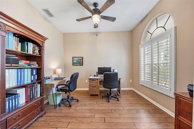 25942 Risen Star Dr, Wesley Chapel, FL 33544 - home office with ceiling fan and light wood-style flooring