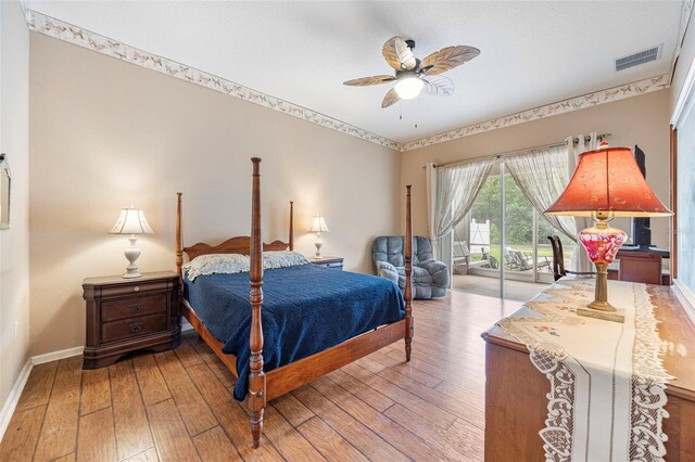 25942 Risen Star Dr, Wesley Chapel, FL 33544 - bedroom featuring access to exterior, wood-type flooring, and a ceiling fan