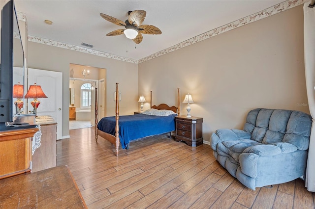 25942 Risen Star Dr, Wesley Chapel, FL 33544 - bedroom featuring light wood finished floors, ceiling fan, and ensuite bath