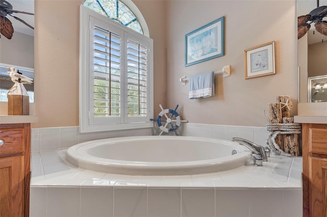 25942 Risen Star Dr, Wesley Chapel, FL 33544 - bathroom featuring vanity and a garden tub