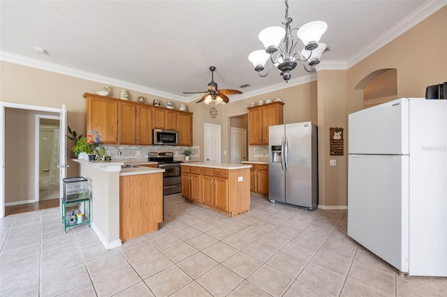 25942 Risen Star Dr, Wesley Chapel, FL 33544 - kitchen featuring stainless steel appliances, light countertops, light tile patterned floors, a chandelier, and ornamental molding