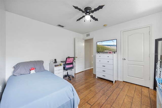25942 Risen Star Dr, Wesley Chapel, FL 33544 - bedroom featuring hardwood / wood-style floors and a ceiling fan
