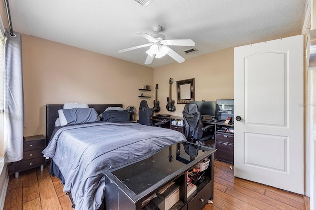 25942 Risen Star Dr, Wesley Chapel, FL 33544 - bedroom with light wood-style floors, an office area, and ceiling fan