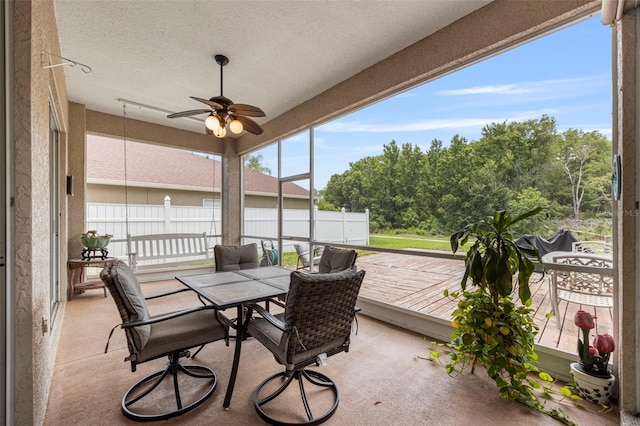 25942 Risen Star Dr, Wesley Chapel, FL 33544 - sunroom / solarium with a ceiling fan, outdoor dining area, and a textured ceiling