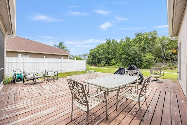 25942 Risen Star Dr, Wesley Chapel, FL 33544 - wooden deck with outdoor dining space