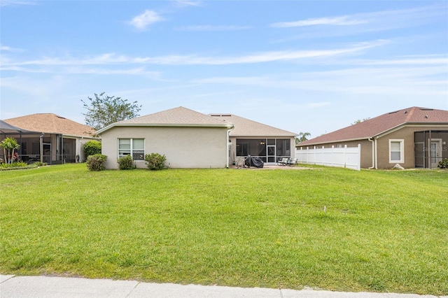 25942 Risen Star Dr, Wesley Chapel, FL 33544 - rear view of property featuring a sunroom and stucco siding