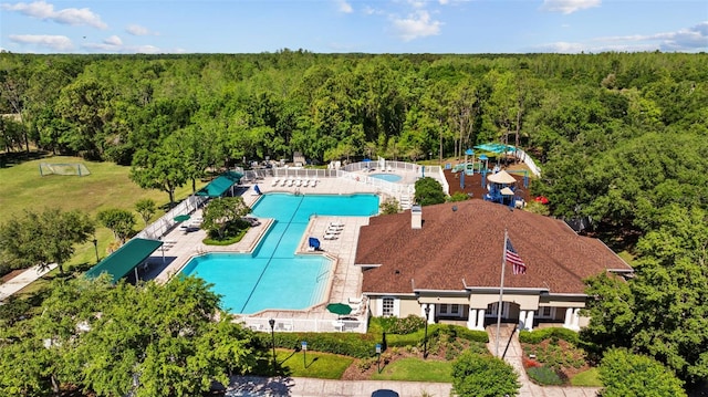 25942 Risen Star Dr, Wesley Chapel, FL 33544 - aerial view of a forest and a pool