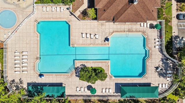 25942 Risen Star Dr, Wesley Chapel, FL 33544 - drone / aerial view of a pool area