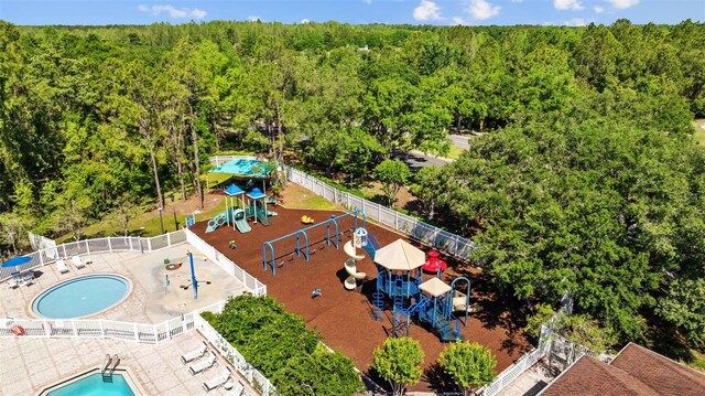 25942 Risen Star Dr, Wesley Chapel, FL 33544 - bird's eye view of a heavily wooded area and a pool area