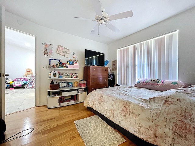 1599 Mcauliffe Ln, Palm Harbor, FL 34683 - bedroom featuring light wood-style flooring and ceiling fan