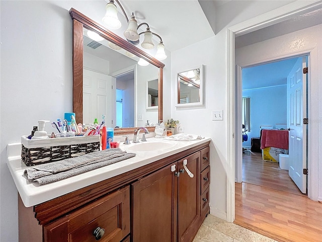 1599 Mcauliffe Ln, Palm Harbor, FL 34683 - bathroom with vanity and wood finished floors