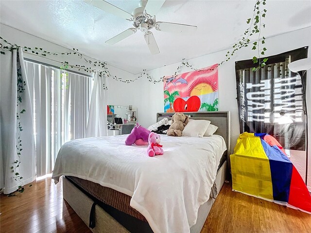 1599 Mcauliffe Ln, Palm Harbor, FL 34683 - bedroom featuring hardwood / wood-style floors and ceiling fan