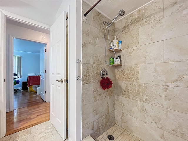 1599 Mcauliffe Ln, Palm Harbor, FL 34683 - full bathroom with a shower stall and wood finished floors