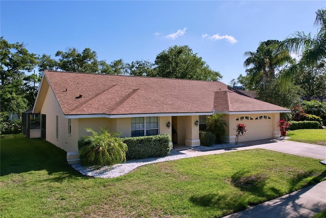 1599 Mcauliffe Ln, Palm Harbor, FL 34683 - ranch-style home with stucco siding, an attached garage, concrete driveway, and a front lawn