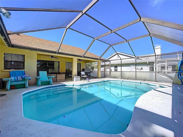 1599 Mcauliffe Ln, Palm Harbor, FL 34683 - view of swimming pool featuring ceiling fan, a patio, and glass enclosure