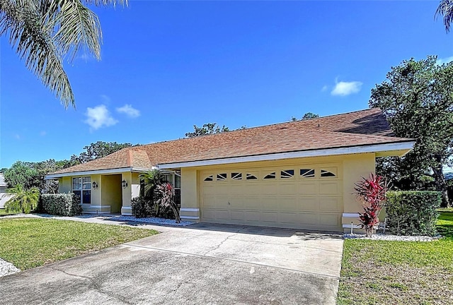 1599 Mcauliffe Ln, Palm Harbor, FL 34683 - ranch-style house featuring stucco siding, concrete driveway, an attached garage, and a front lawn