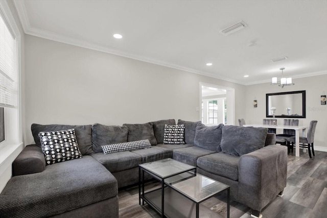 6020 N 50th St, Tampa, FL 33610 - living area featuring dark wood finished floors, a chandelier, crown molding, recessed lighting, and baseboards
