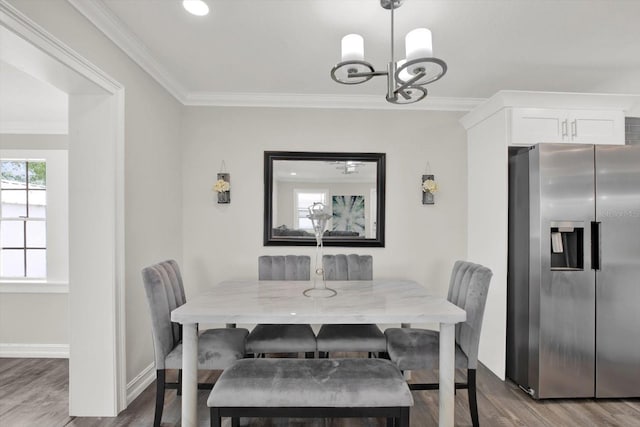 6020 N 50th St, Tampa, FL 33610 - dining room featuring wood finished floors, a chandelier, ornamental molding, baseboards, and recessed lighting