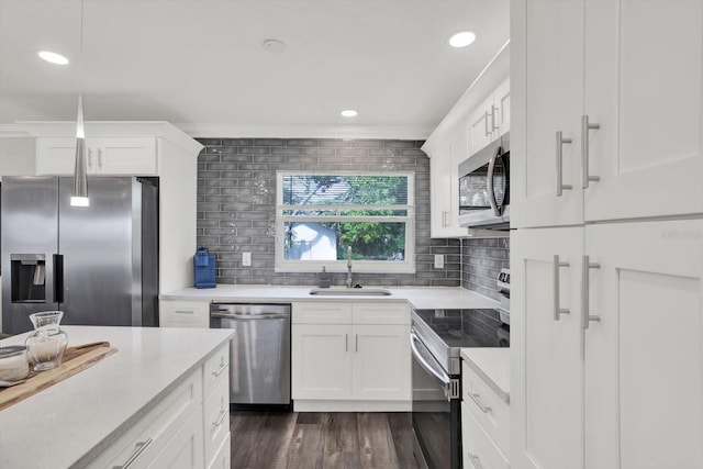6020 N 50th St, Tampa, FL 33610 - kitchen featuring stainless steel appliances, a sink, decorative backsplash, light countertops, and recessed lighting