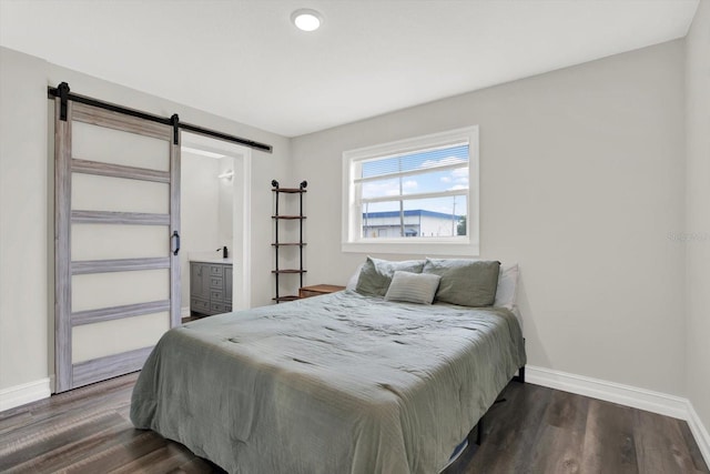 6020 N 50th St, Tampa, FL 33610 - bedroom with a barn door, baseboards, and dark wood finished floors
