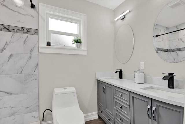 6020 N 50th St, Tampa, FL 33610 - bathroom featuring a marble finish shower, double vanity, and toilet
