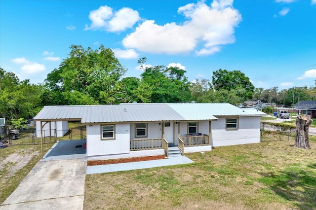 6020 N 50th St, Tampa, FL 33610 - ranch-style house featuring a porch, a carport, metal roof, and driveway