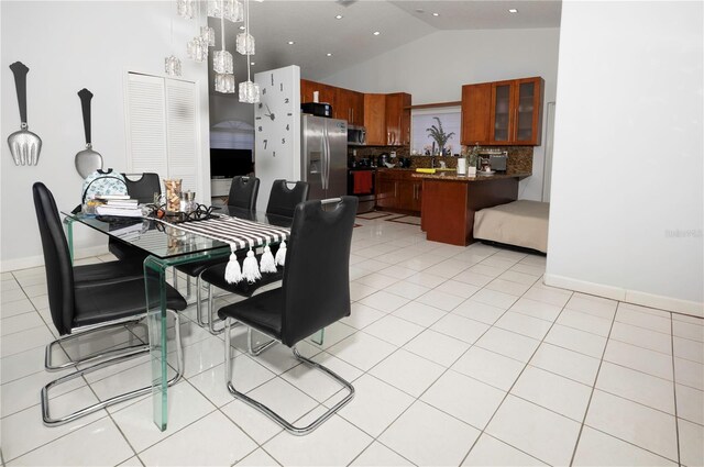 2901 SW 136th Ct, Miami, FL 33175 - dining room with high vaulted ceiling, light tile patterned flooring, and baseboards